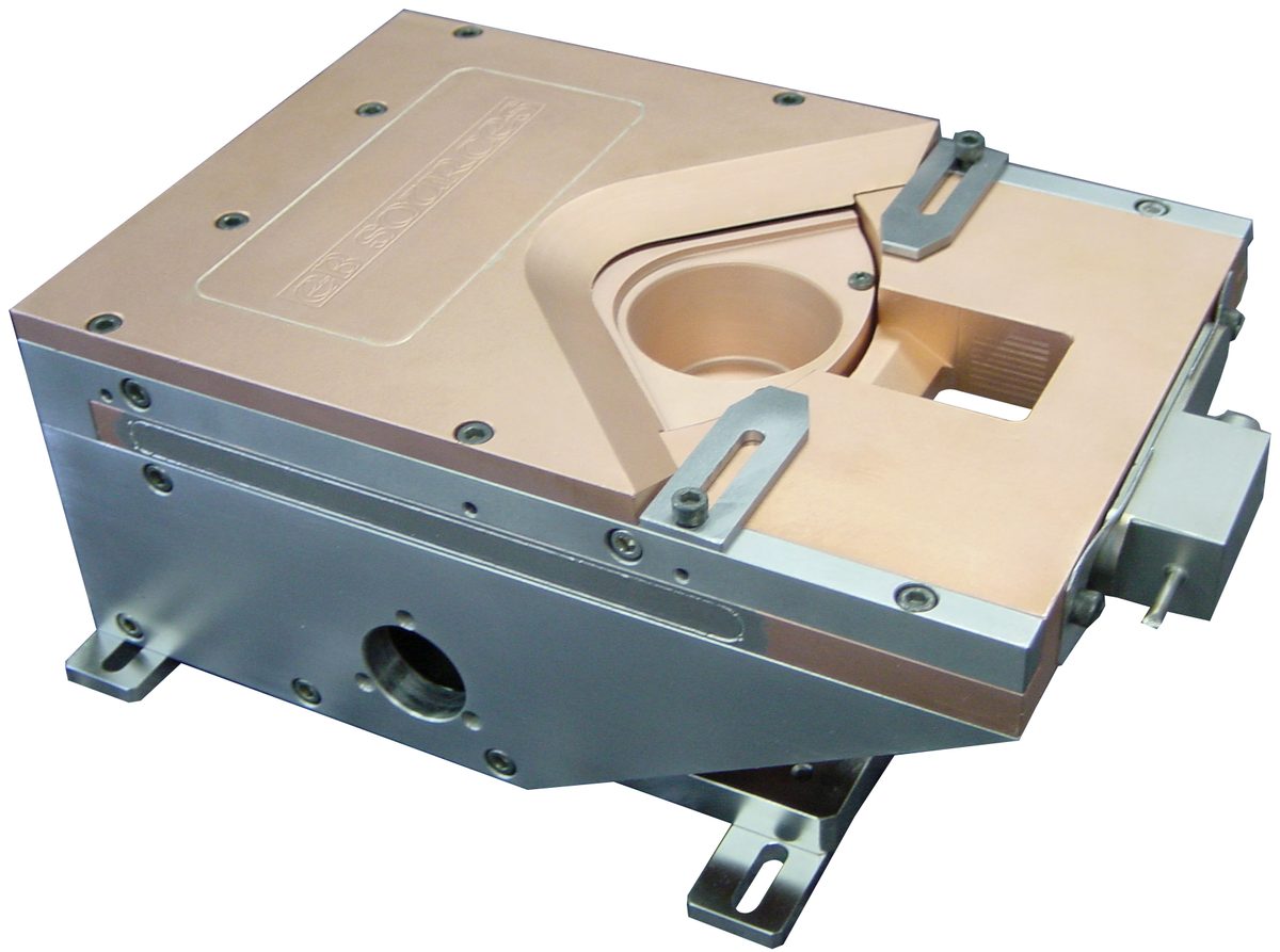 EB2 multi-pocket electron-beam source, the production standard, shown from above with its copper hearth and mounting brackets.