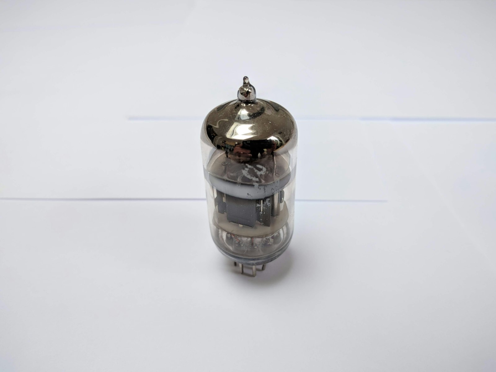 Side view of an EB Sources evaporation source installed in a vacuum chamber, highlighting precision engineering.
